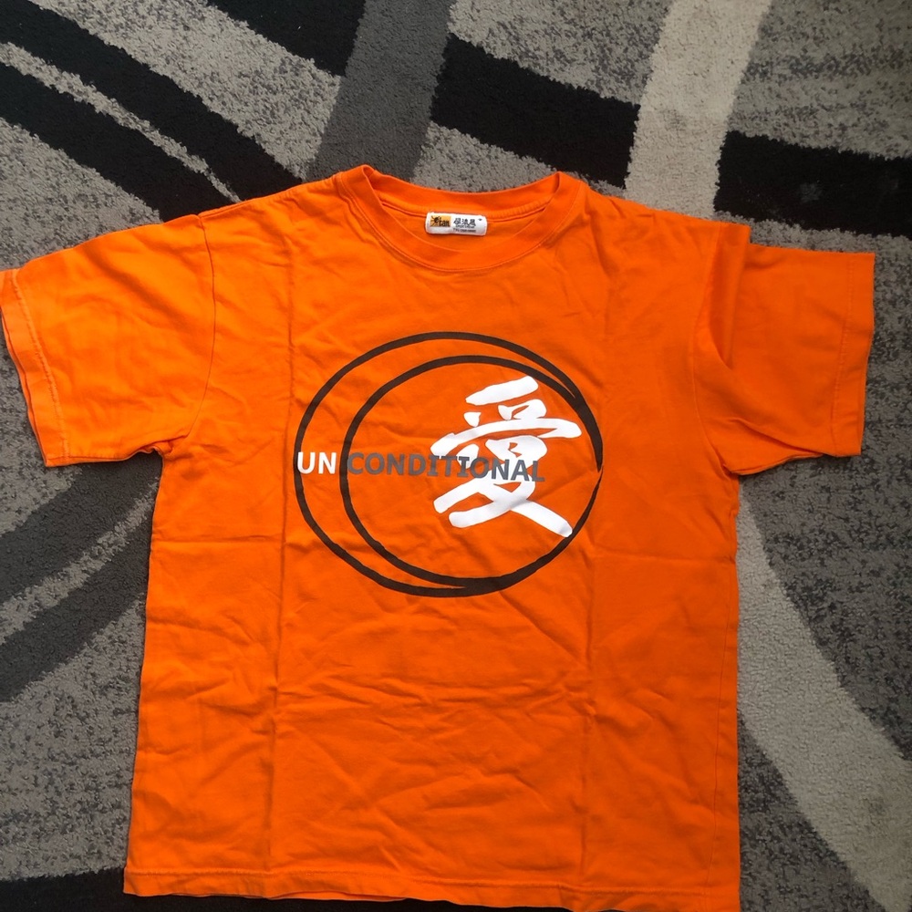 Unconditional Bright Orange Graphic Tee with Black & White Logo